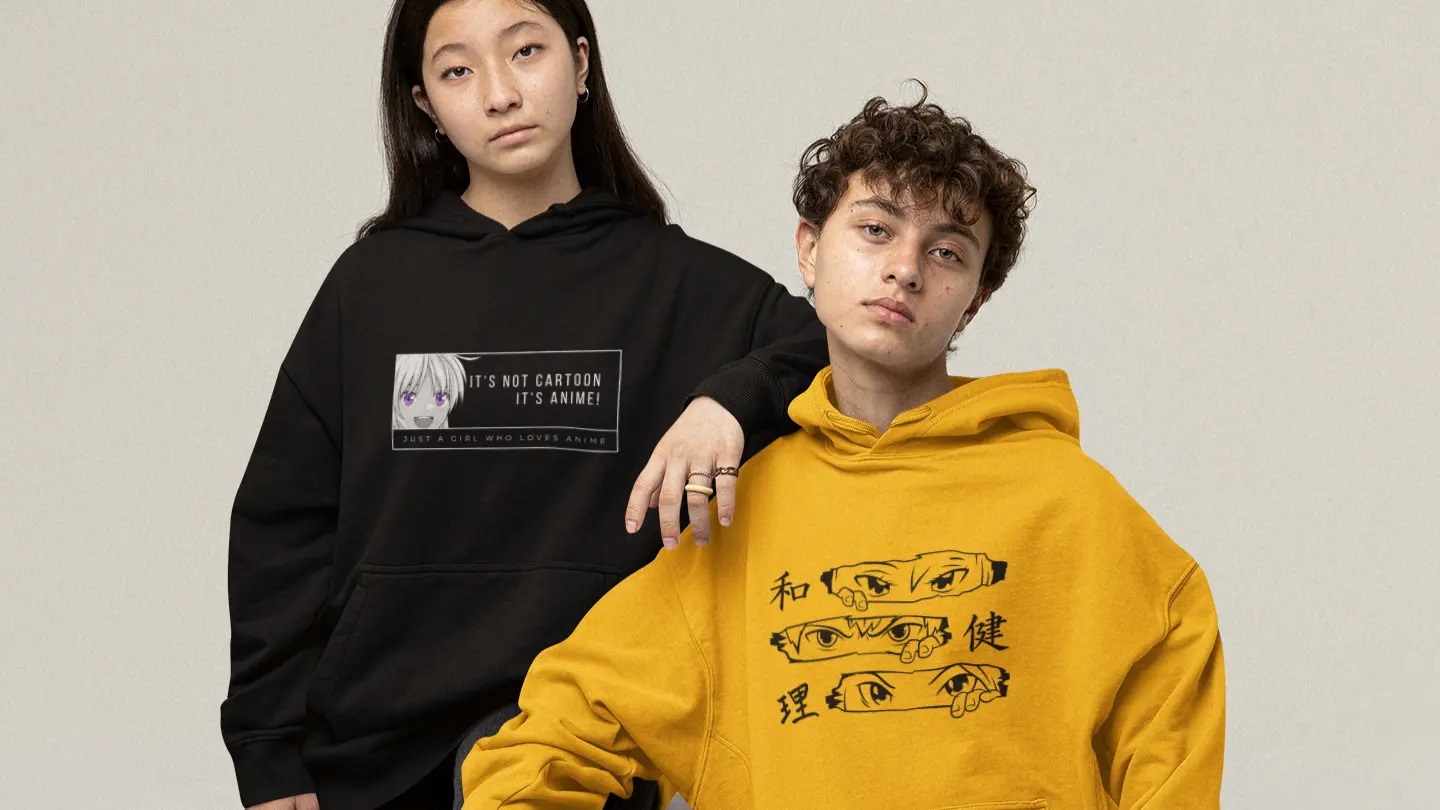 oversized-hoodie-mockup-of-a-serious-couple-sitting-in-cubes-at-a-studio-m26223